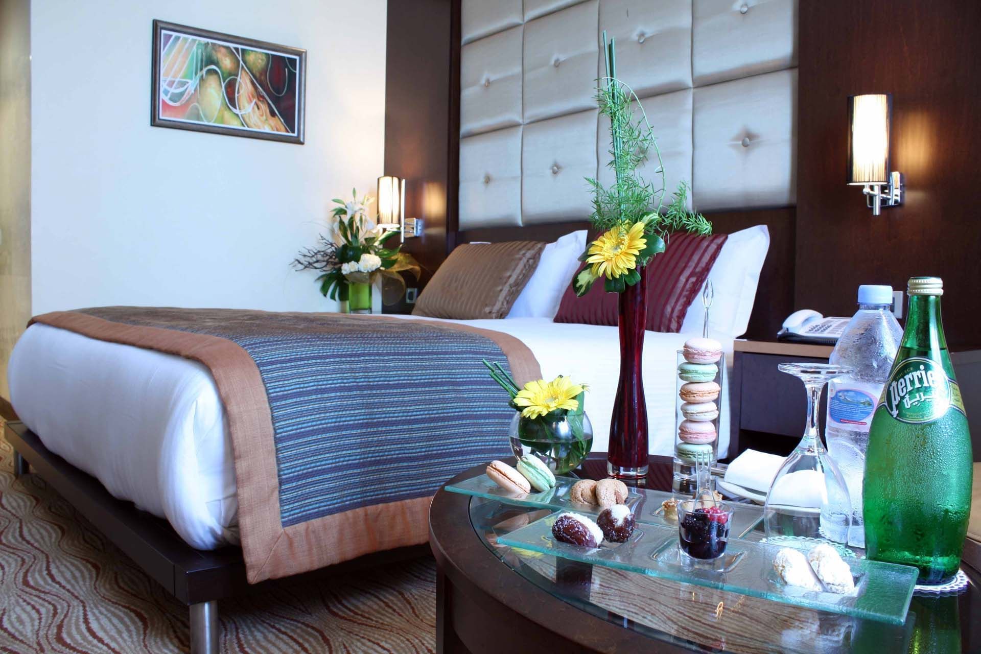 Queen Size Bed with a side Table - Farah Casablanca Hotel