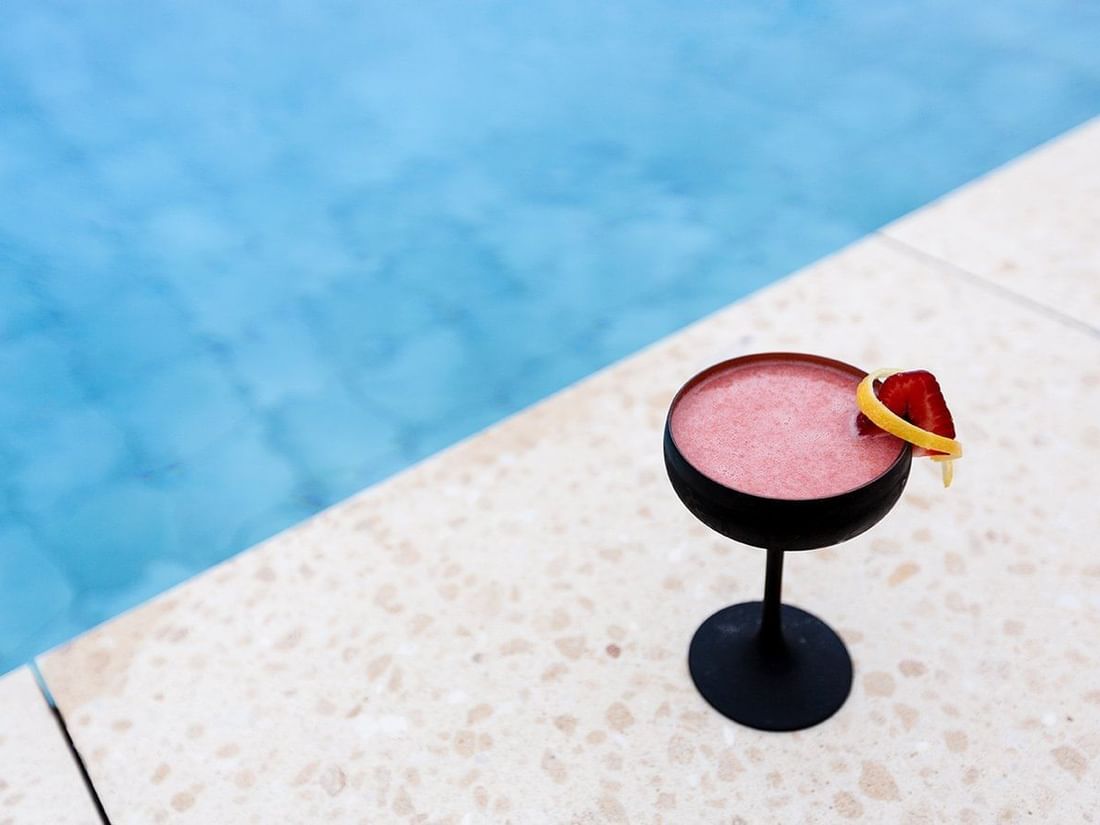 Close up of mocktail served by pool at Pullman Bunker Bay Resort