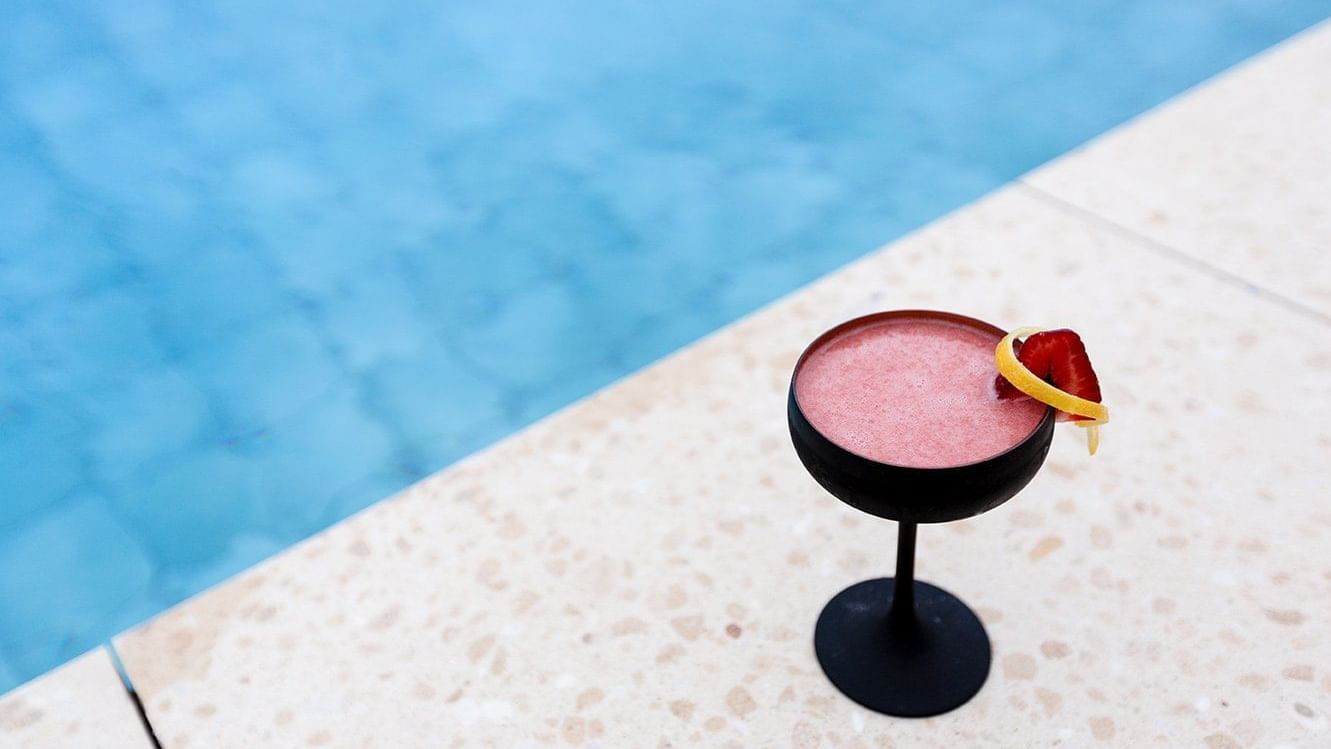 Closeup of mocktail served by pool at Pullman Bunker Bay Resort