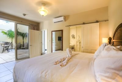 Comfortable bed in 2 Bedroom Lanai Bungalow at Windsong Resort On The Reef