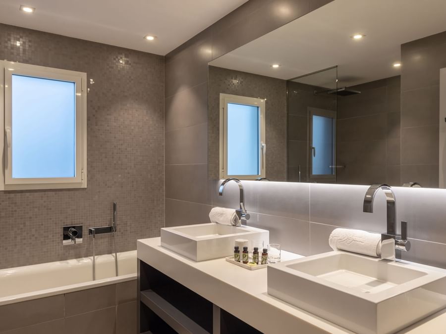 Bathroom vanity in bedrooms at Hotel Golf Chateau de la Begude