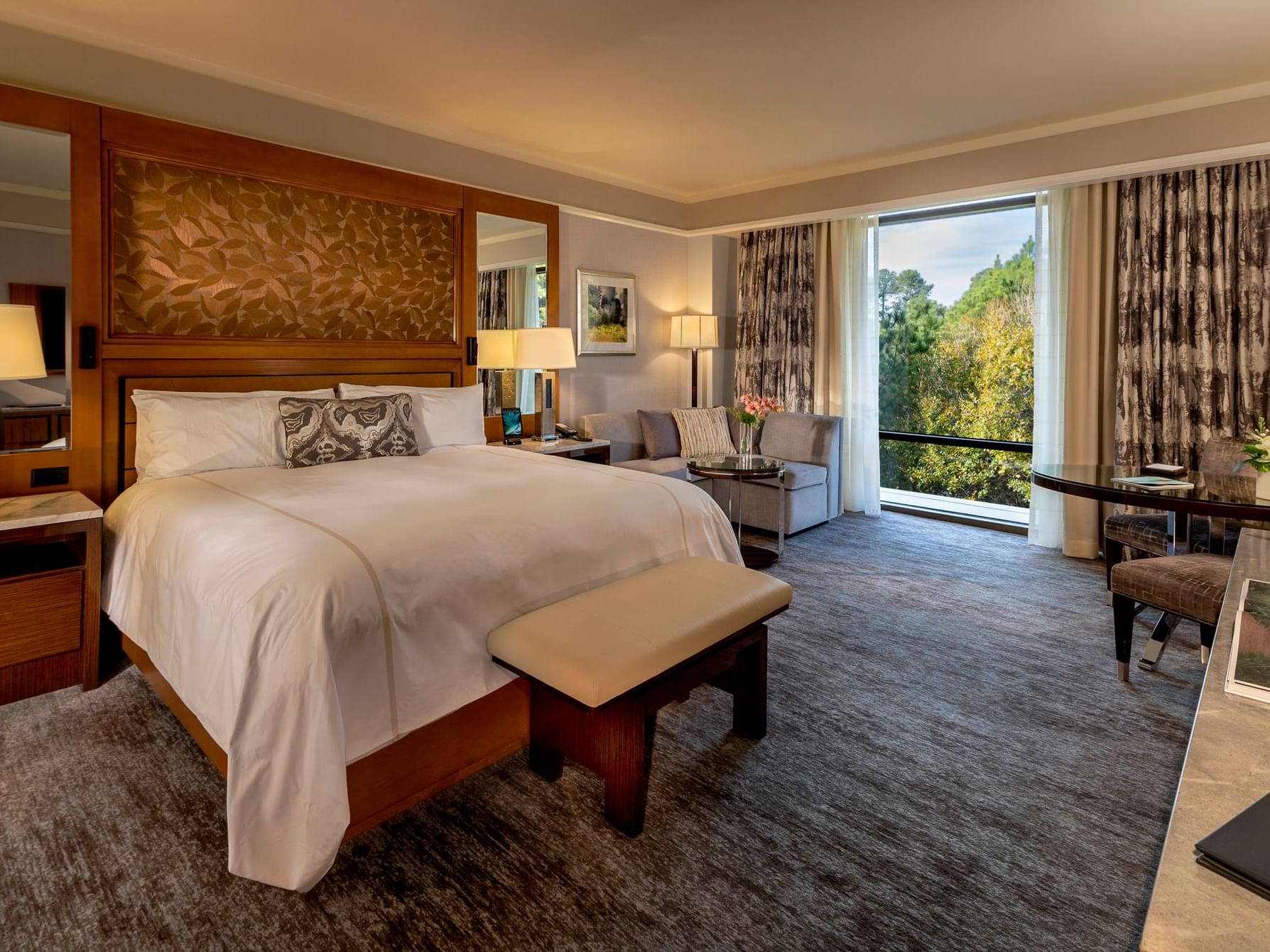 Cozy interior in Premier Room, overlooking the naturally landscaped grounds at The Umstead Hotel and Spa