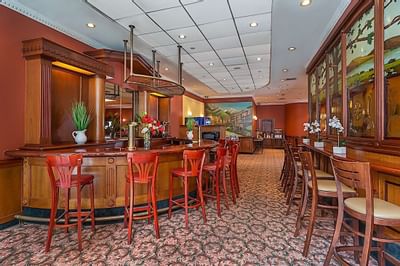 Bar stools by the Bar counter at Chelsea Savoy Hotel.