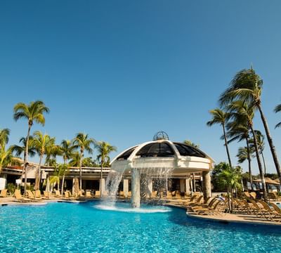 Pool area with pool chairs at Pierre Mundo Imperial