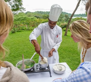 A Chef Preparing a dish outdoors at Arusha Serena Hotels