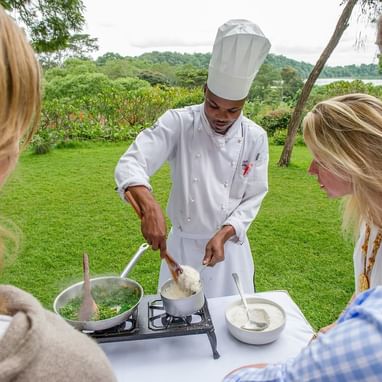 A Chef Preparing a dish outdoors at Arusha Serena Hotels