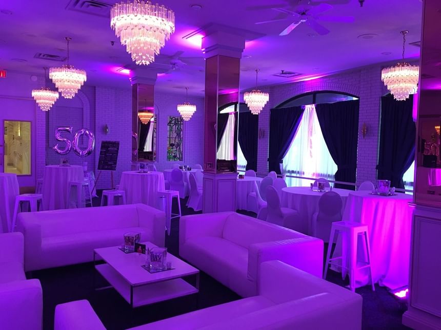 An event room with purple neon lights at Carriage House Hotel