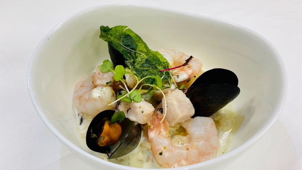 Seafood stew with mussels under a crispy leaf in Abbiocco at Warwick Paradise Island Bahamas