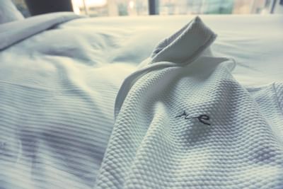 Close-up of a bathrobe on a bed at ReStays Ottawa