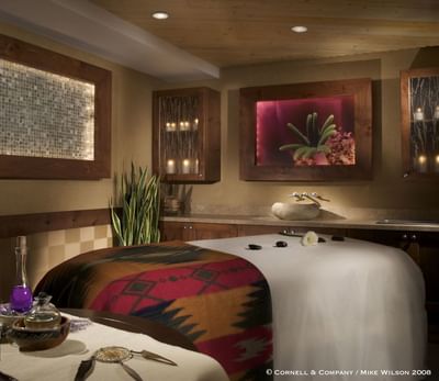 Wo'P'in Spa treatment room at Hilton Santa Fe Buffalo Thunder with warm lighting and a peaceful ambiance
