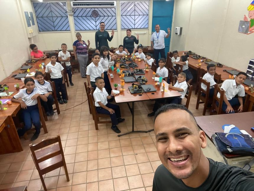 Group members and children posing smilingly for a selfie at Fiesta Resort