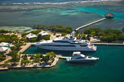 Aerial view of yachts docked at the marina of best resort in Roatan, Honduras, Barefoot Cay Resort