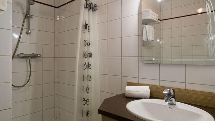 Bathroom vanity of bedrooms at Hotel Helios