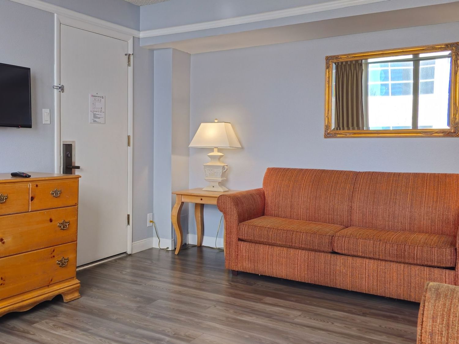 Living area of One-Bedroom Corner Suite at Legacy Vacation Resorts