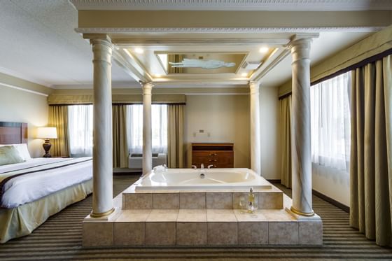 King Bedroom at Monte Carlo Inn Barrie Suites