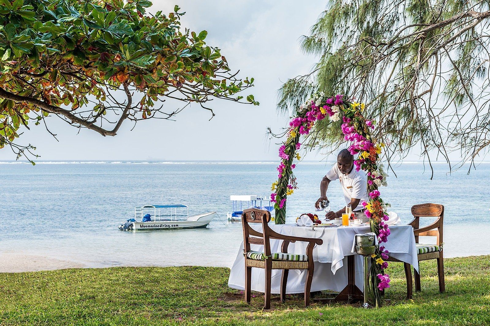 Staff organizing a honeymoon meal at Serena Beach Resort & Spa