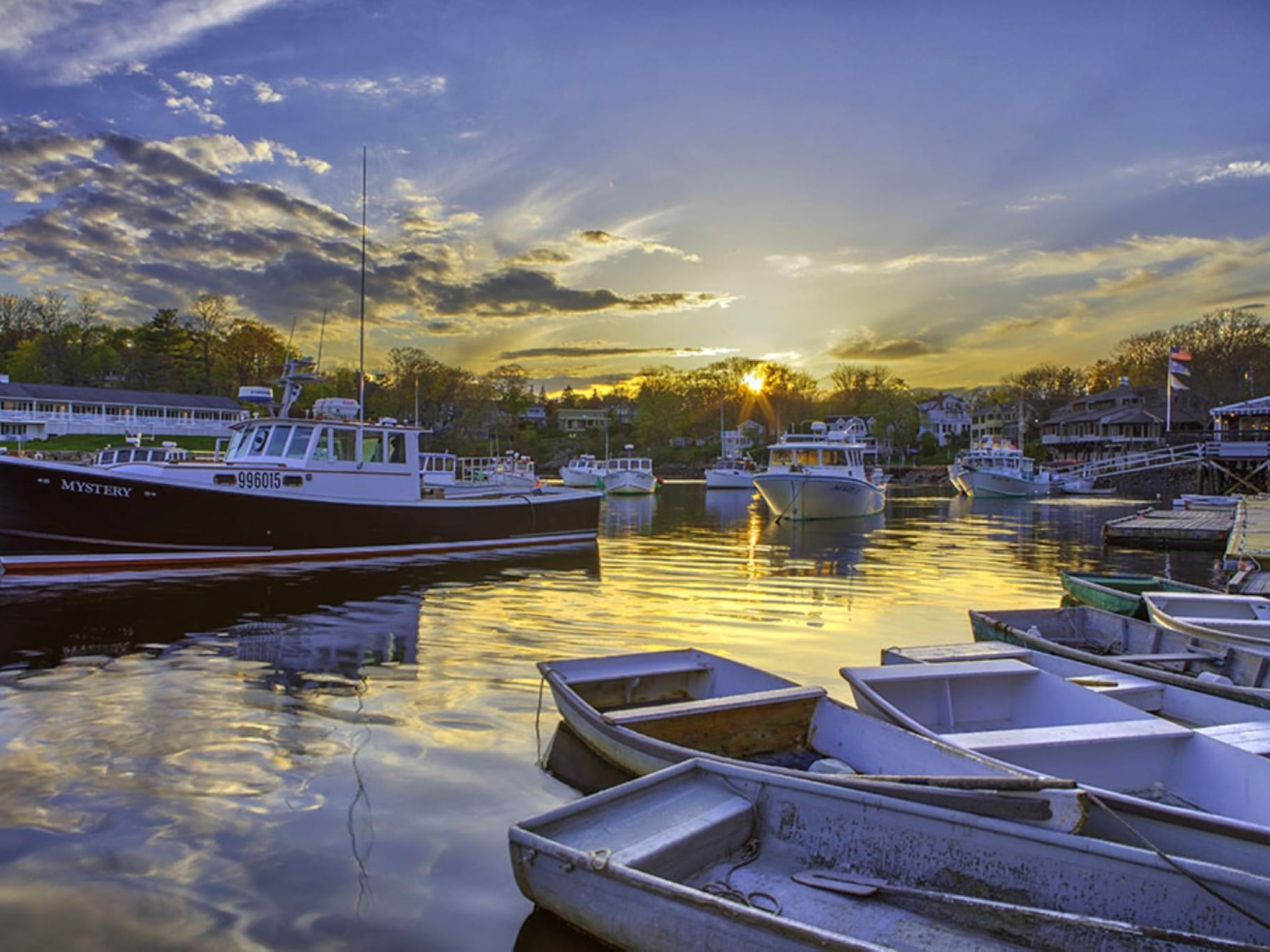 Boats dock in Perkins Cove with a scenic harbor view near Gorges Grant Hotel