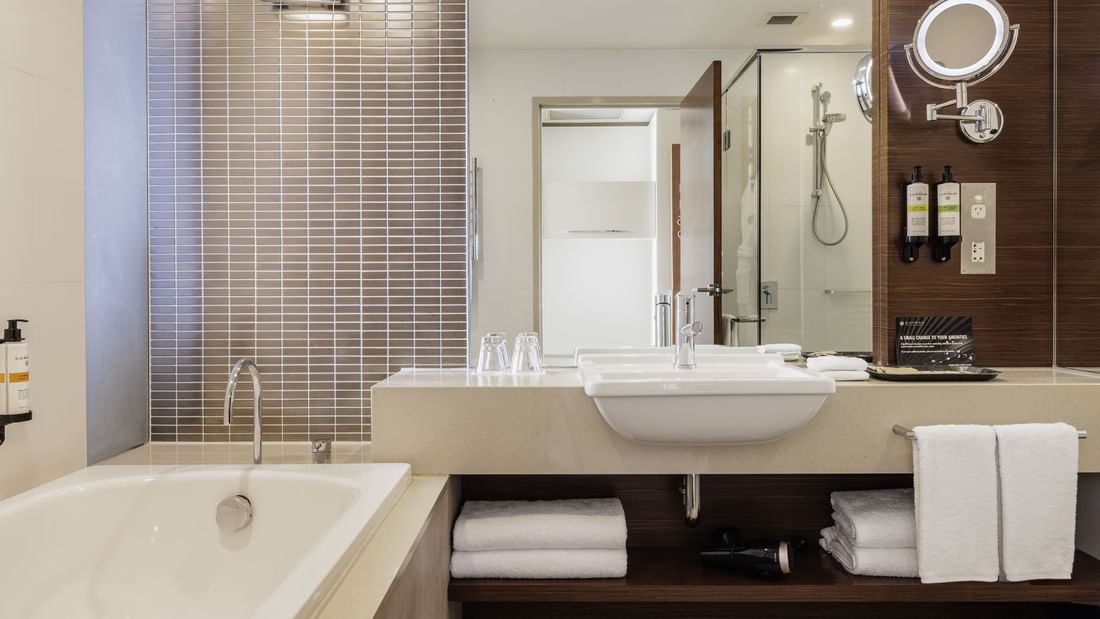 Bathtub by the vanity in Pullman Deluxe King Bathroom at Pullman Sydney Olympic Park