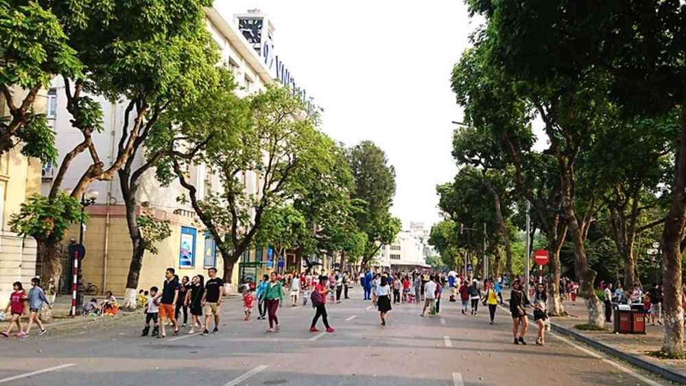 People walking in the streets by Hoàn Kiếm Lake near Sunway Hotel Hanoi