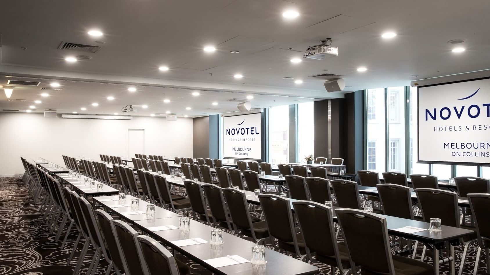 Chairs setup for a conference at Novotel Melbourne on Collins