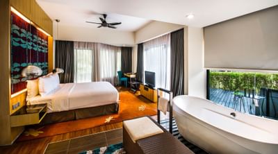 A room connecting to the bathroom with a bathtub 