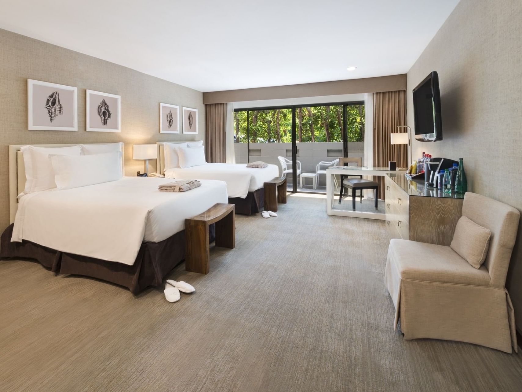 Attractive room with two double beds & a TV At Luxe Sunset