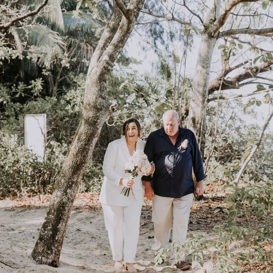 Wedding couple posing at Pullman Palm Cove Sea Temple Resort