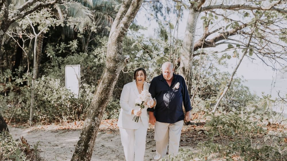 Wedding couple posing at Pullman Palm Cove Sea Temple Resort