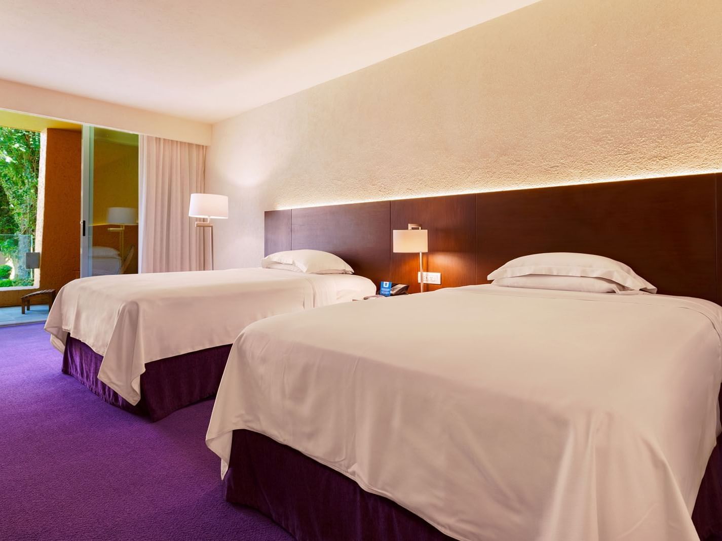 2 Double Superior Deluxe Garden View featuring purple carpeting and a view of greenery outside at Camino Real Polanco Mexico