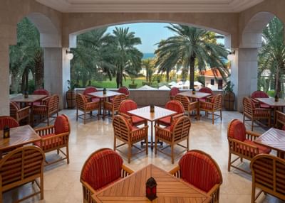 Dining tables at the café on the terrace at Ajman Hotel