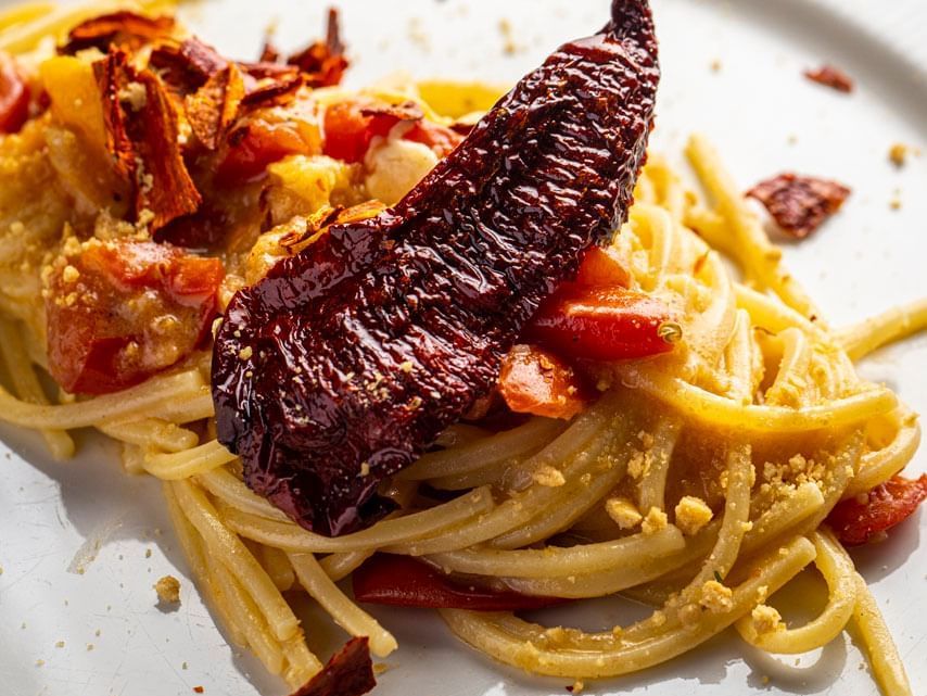 Close-up of a Spaghetti dish served on a white plate in EMME restaurant at Margutta 19