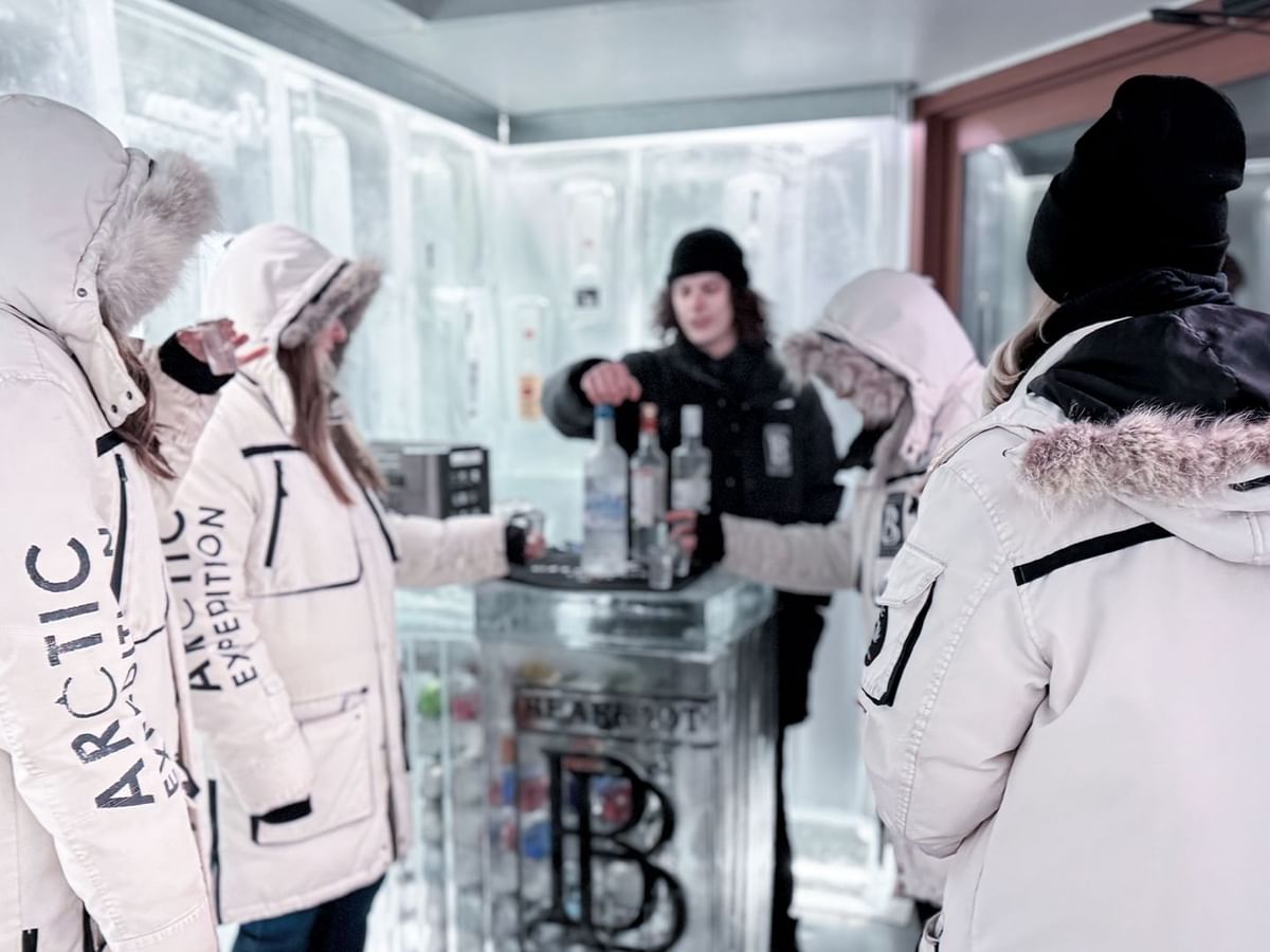 Guests enjoying vodka inside the Grey Goose Ice Room