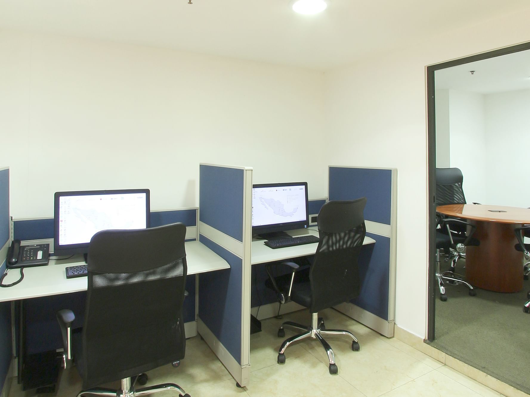 Desktop computers arranged in Business Center at One Hotels