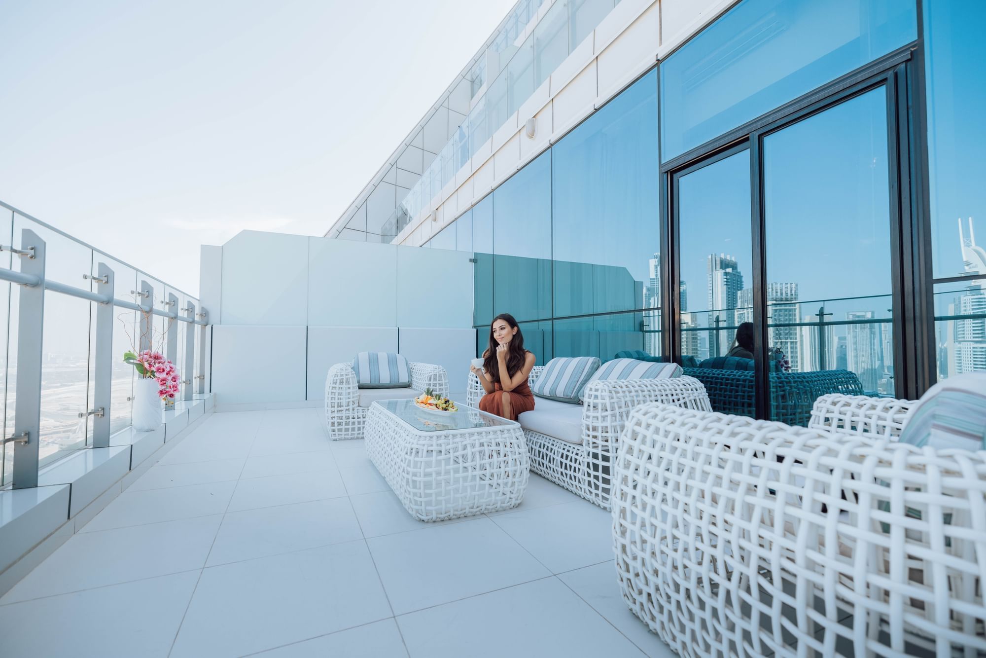 Outdoor lounge area on the rooftop at Maison Royale The Distinction