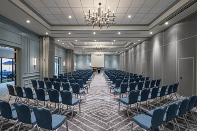 Theater seating layout with chairs facing the presentation screen in the Grand Ballroom at Sable Oaks Weddings and Events