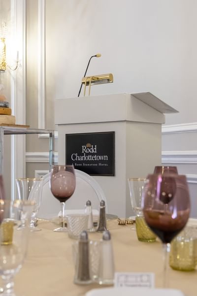 White presentation podium with wine glasses at Rodd Charlottetown Hotel, a top-rated rodd Charlottetown