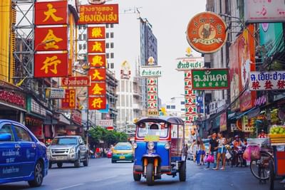 A busy Chinese city with a lot of vehicles near Dream Bangkok