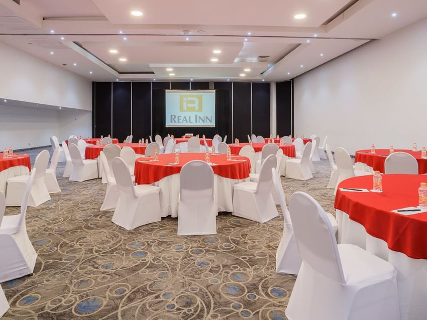 Palermo event room at Real Inn Tijuana with round tables and chairs set up