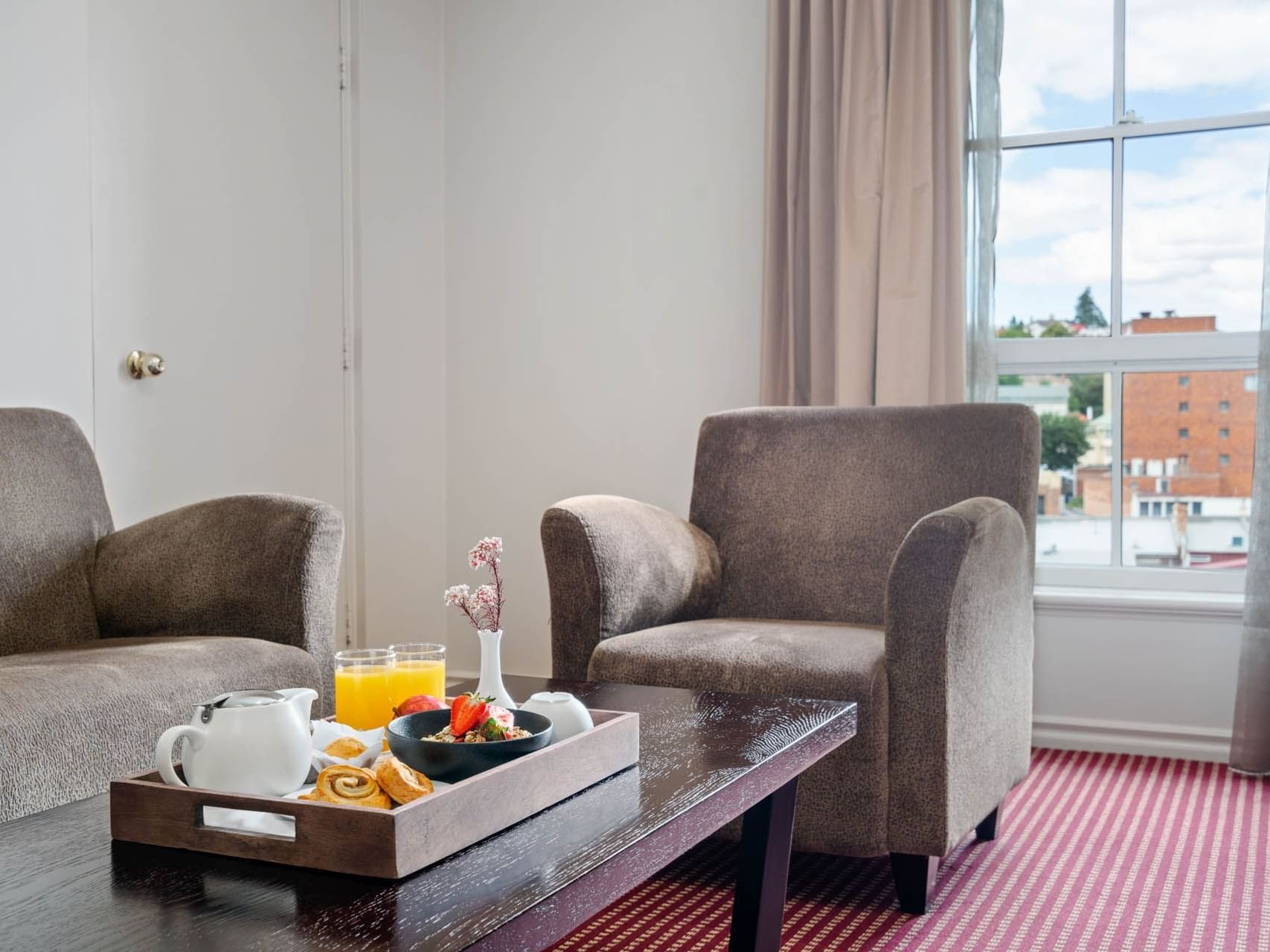 Breakfast served by the lounge window in One Bedroom Suite at Grand Chancellor Launceston