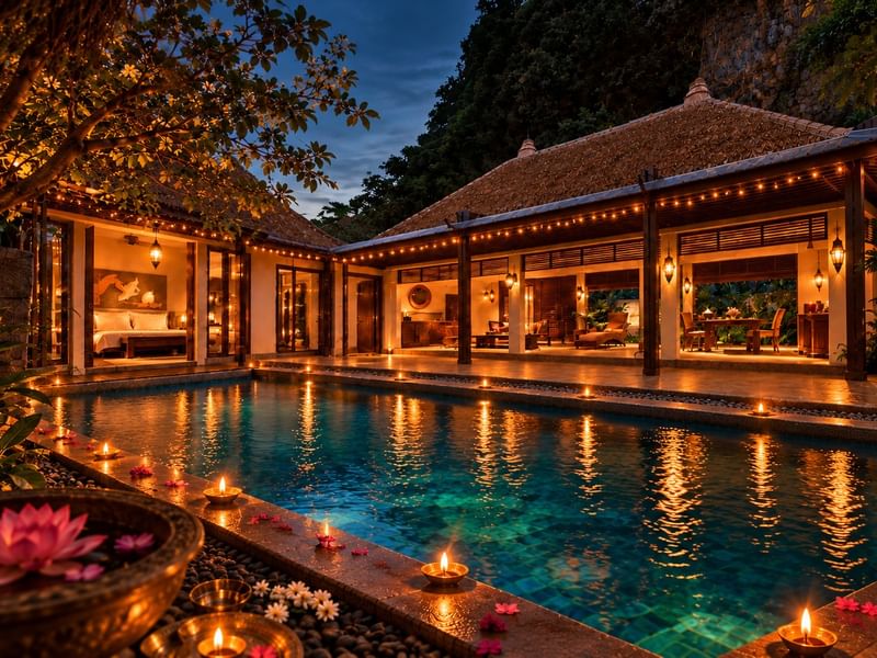 Deepavali Celebration Escape features a thatched-roof villa with glowing pool, string lights, and complimentary high tea at The Banjaran Hotsprings Retreat.