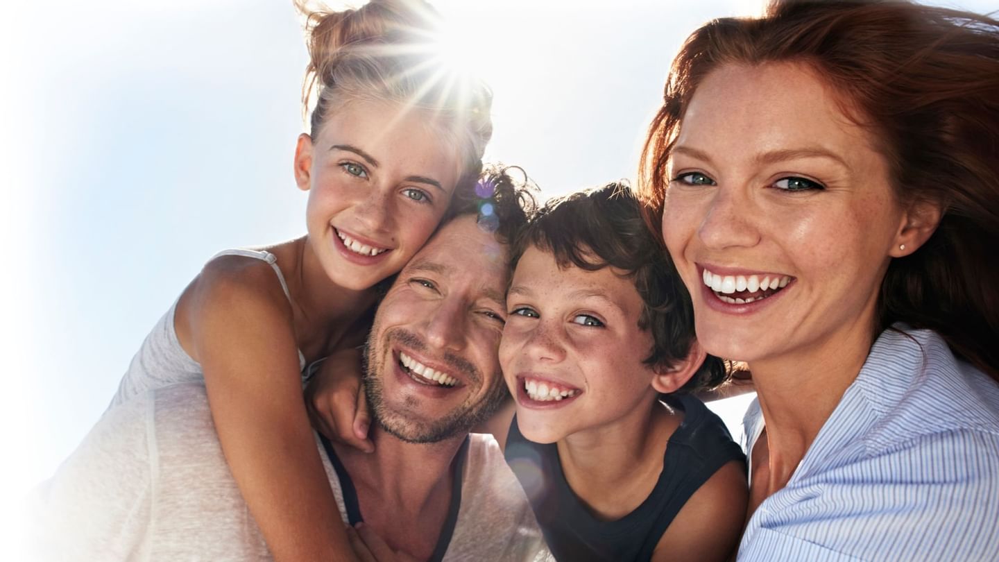 A Family posing for an image at Sunway Putra Hotel