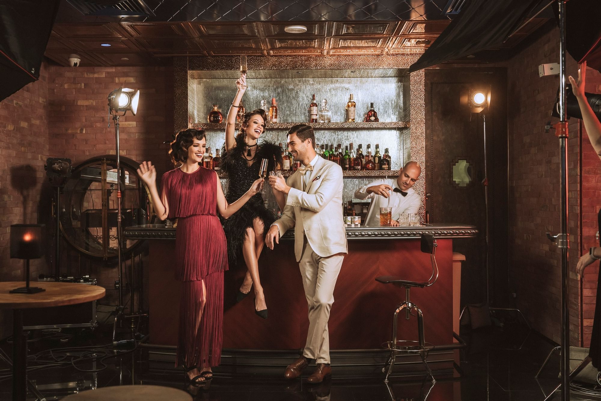 A group of people enjoy in the Flashback Speakeasy Bar & Lounge at Paramount Hotel Dubai