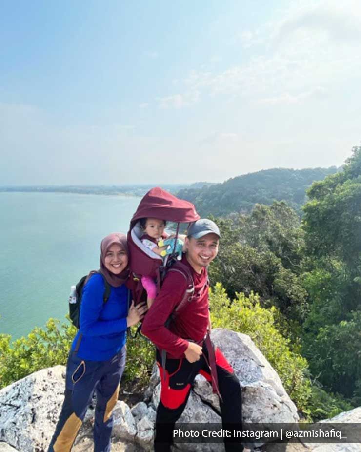 a family hiking up a mountain