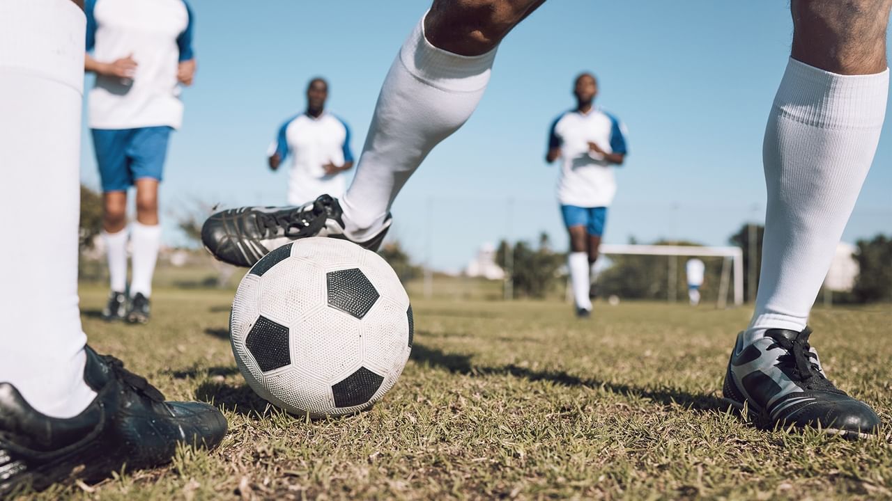 people playing soccer on the field