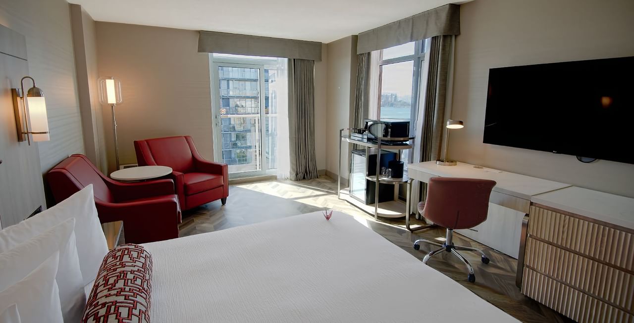 Hotel guestroom with two queens beds and an ocean view