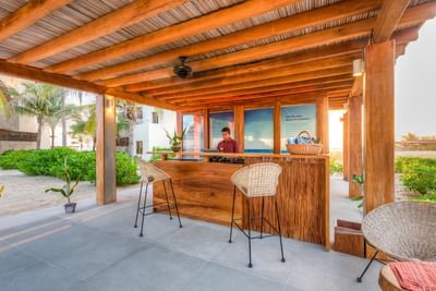 Receptionist by the front desk at Marea Beachfront Villas