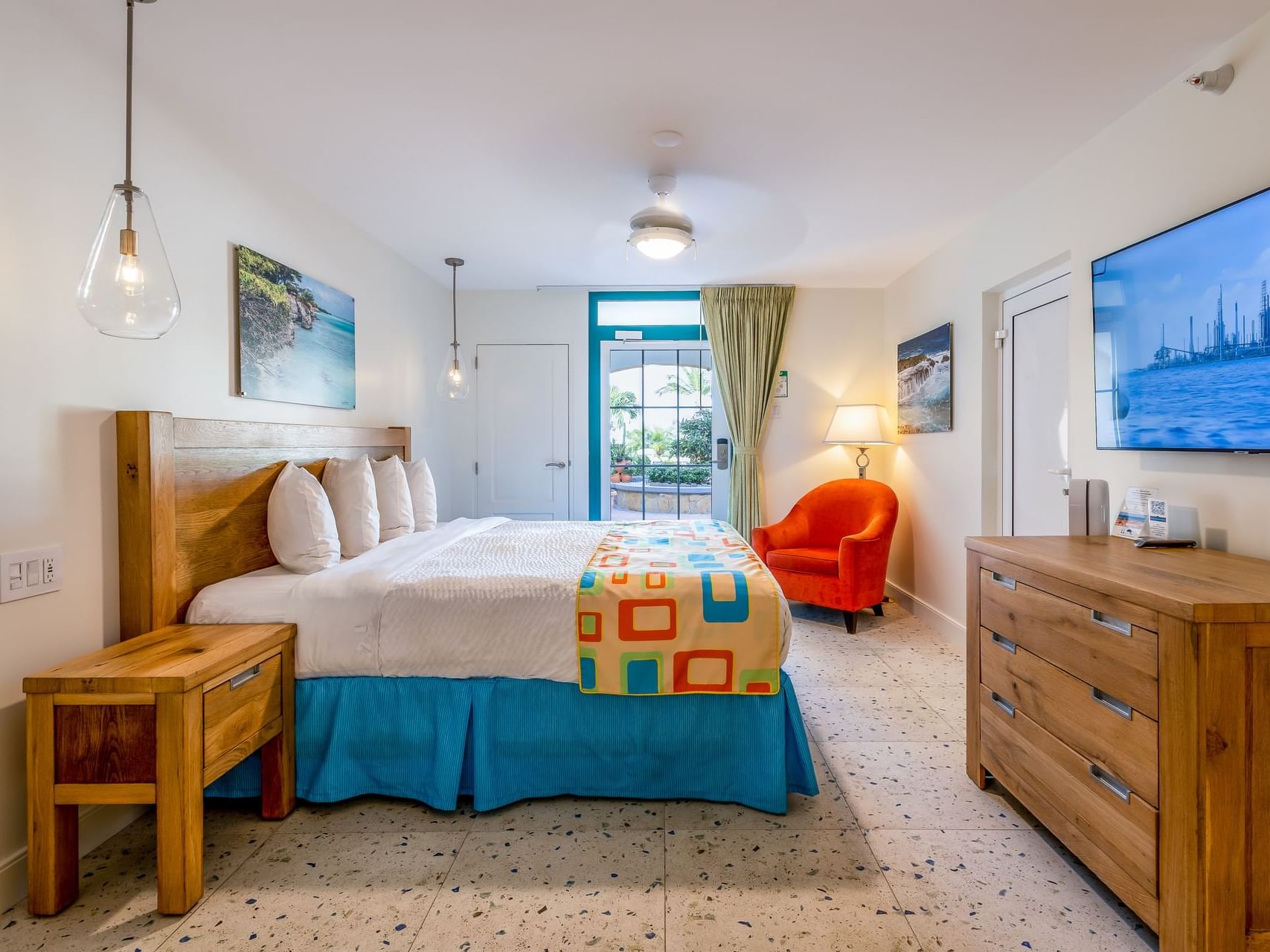 Cozy bedroom featuring a king bed with an outdoor view in Superior Studio at Passions on the Beach