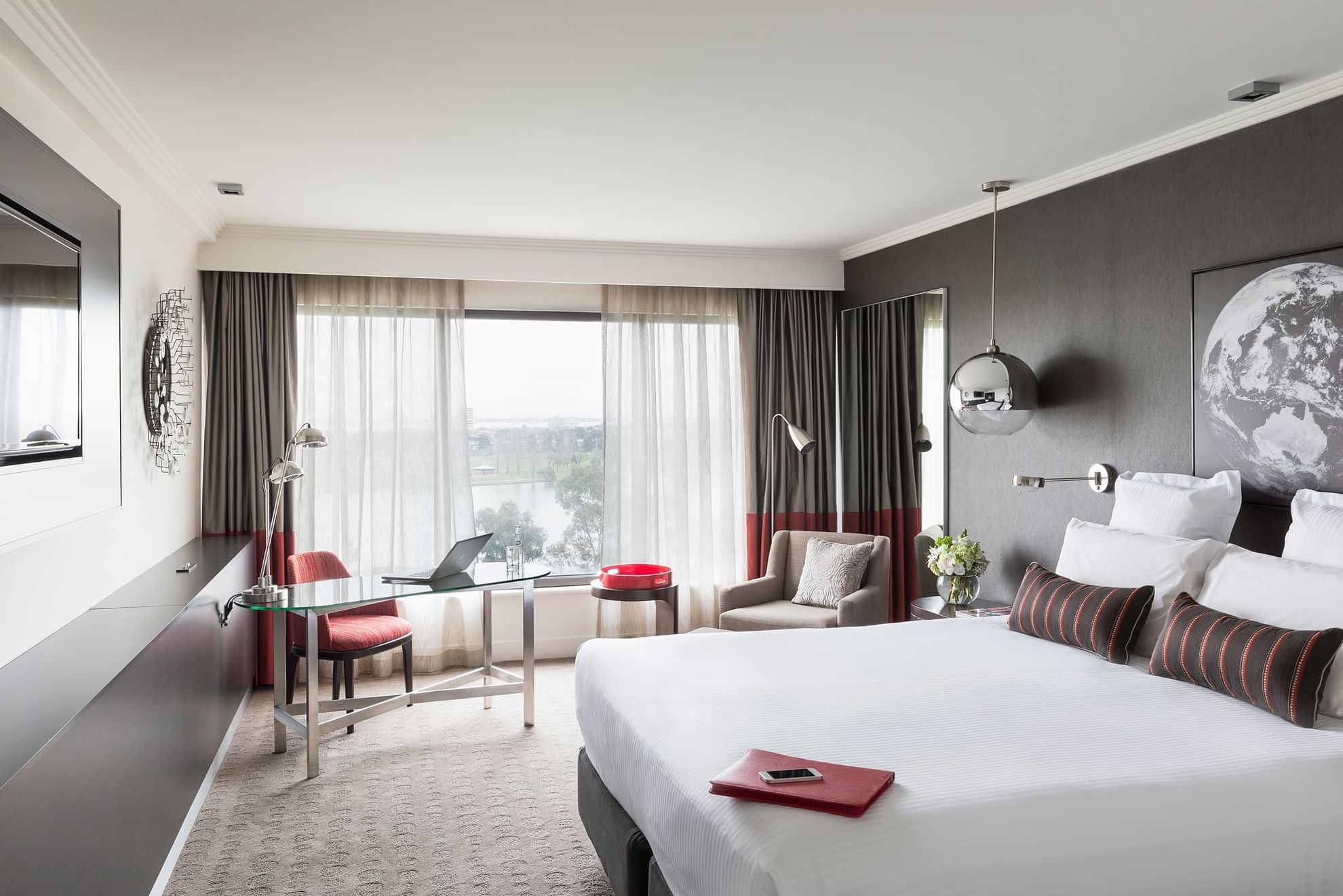 King bed and seating area in Classic Room at Pullman Albert Park