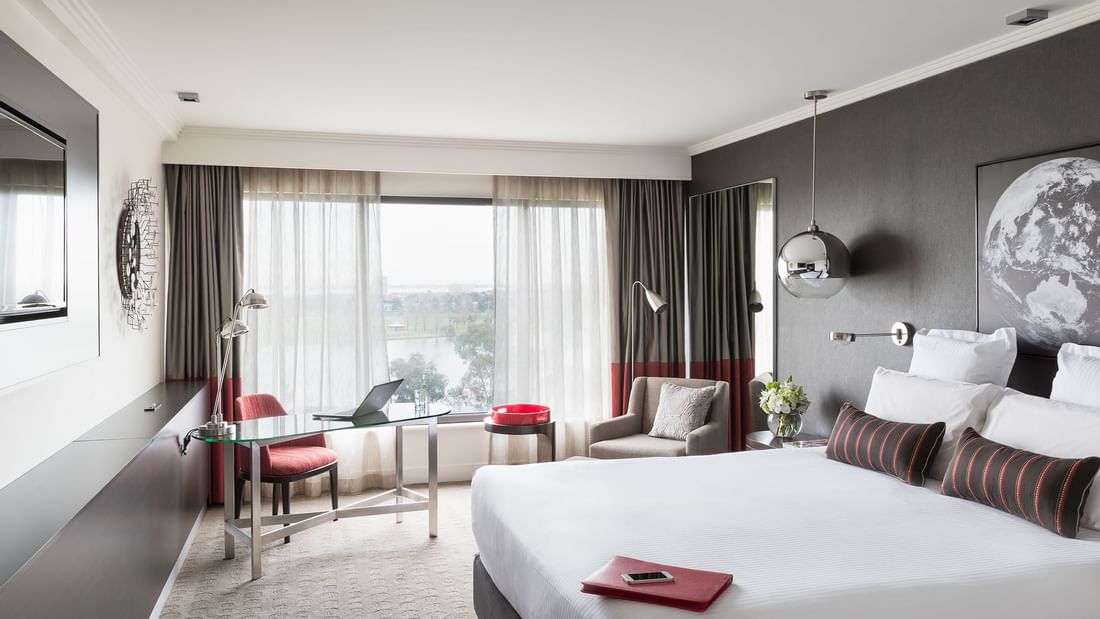 King bed and work area in Classic Room at Pullman Albert Park