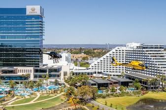 Helicopter flying in front of Crown Hotels Perth